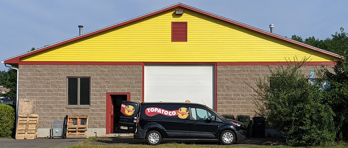 The TopatoCo warehouse, featuring the TopatoCo van.